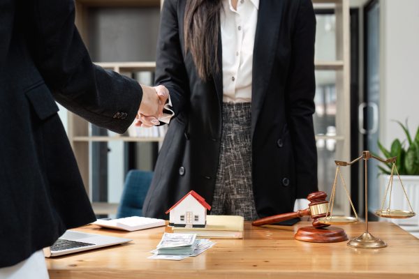Lawyer business women shaking hands with clients, after finishing up a Consulting for insurance