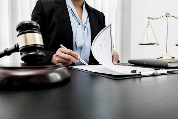 Professional women lawyers work at a law office There are scales, Scales of justice, judges gavel, a